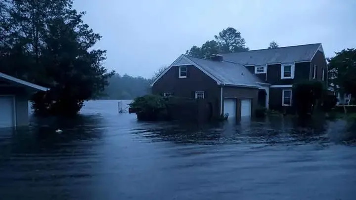 Floodwater surrounding homes after a tropical storm in the Carolinas